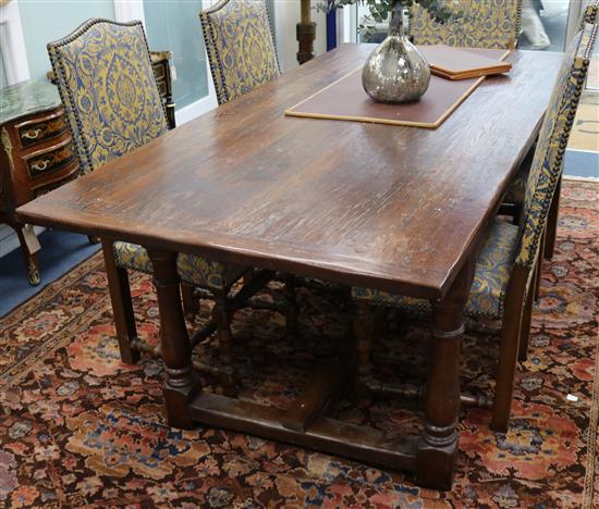 An early 17th century style oak refectory table W.213cm
